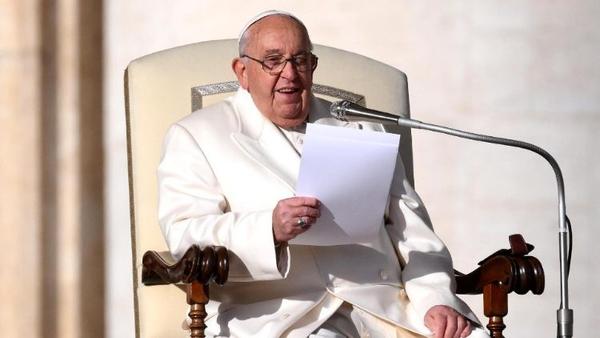 Pope preaching from his chair while holding his script